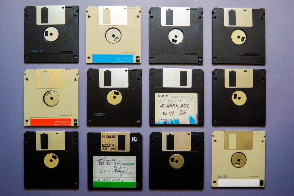 Old floppy discs arranged in a square.  Invest time and money into a website and own your data!